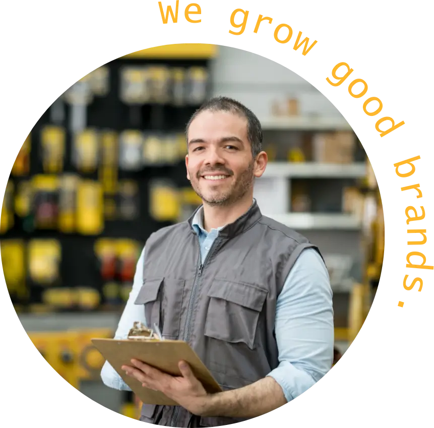 Happy business owner viewing CAUSE SEO Marketing System results with “We Grow Good Brands” graphic.