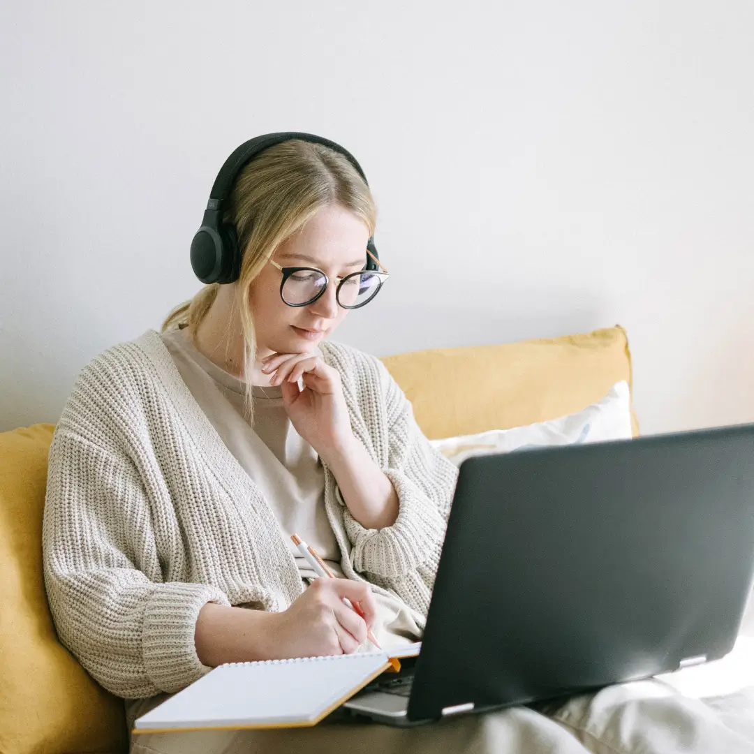 Canadian woman MarketingPRO sitting at her laptop, learning online with her CAUSE mentor and growing her SEO marketing business