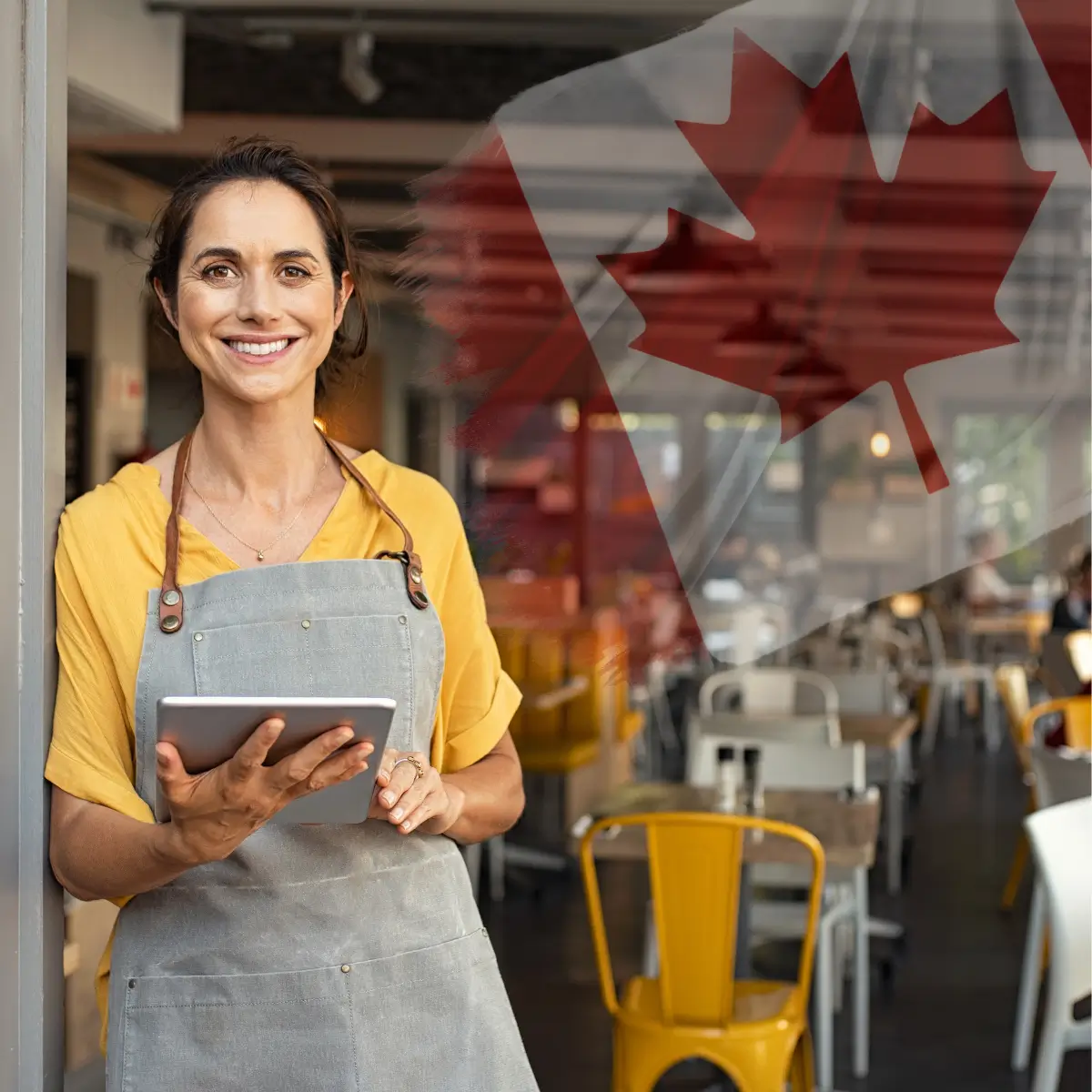 Proud Canadian business owner celebrating growth with SEO support and a Canadian flag